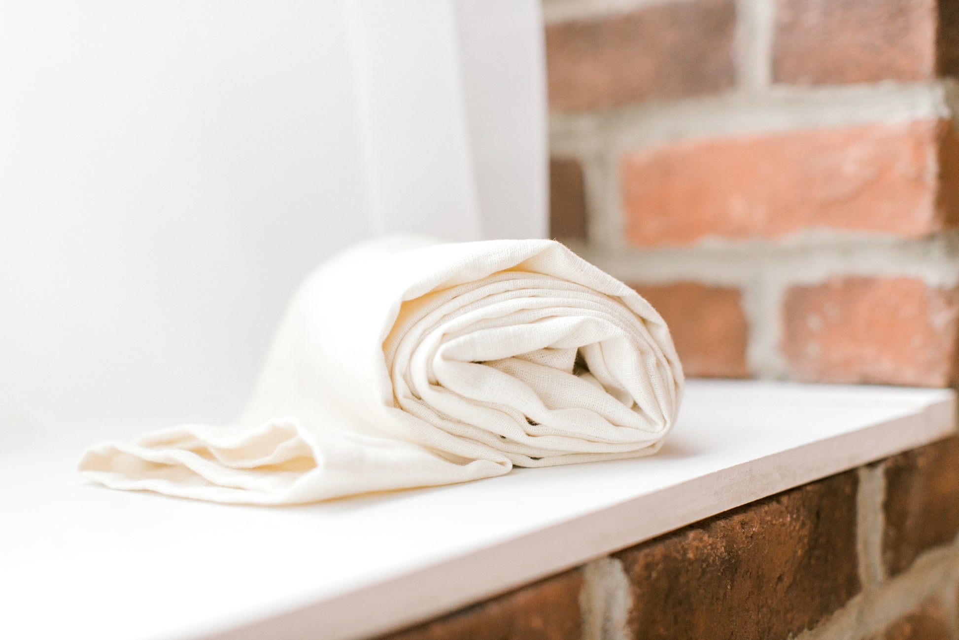 neutral white linen ring sling baby carrier